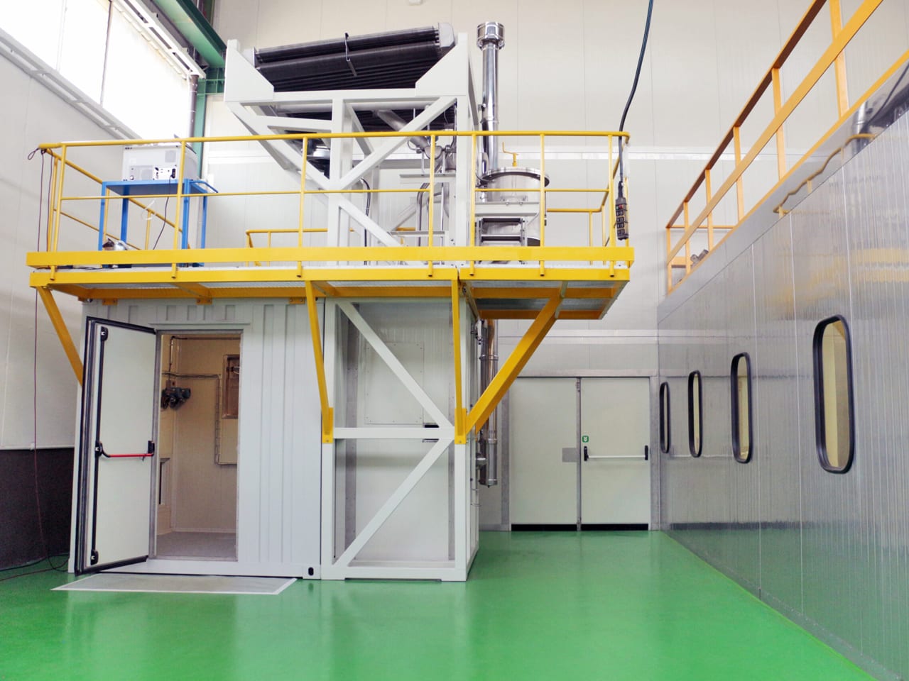 ERPT turbine enclosure with yellow service platform and doors